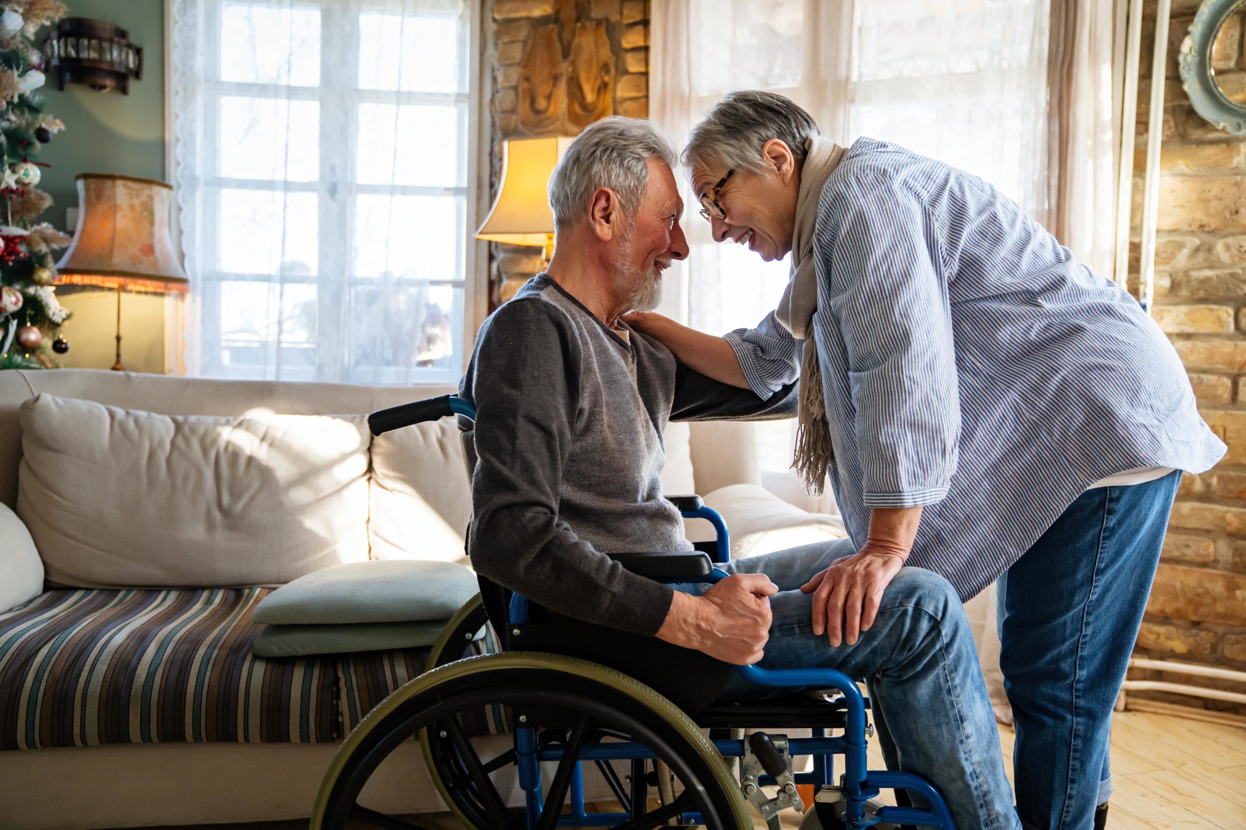 SureSafe Elderly Personal Alarms Government funded personal alarm - elderly couple with mature man in wheelchair