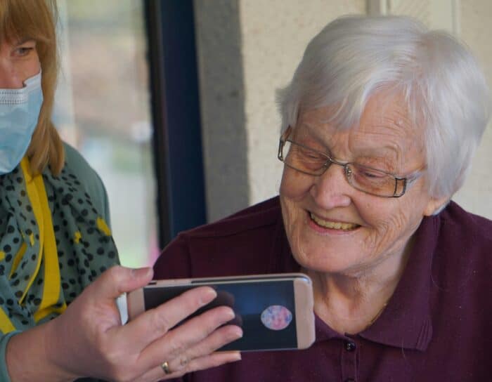 family caring for an elderly woman with dementia